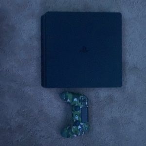 Playstation 4 with a camo dual shock controller